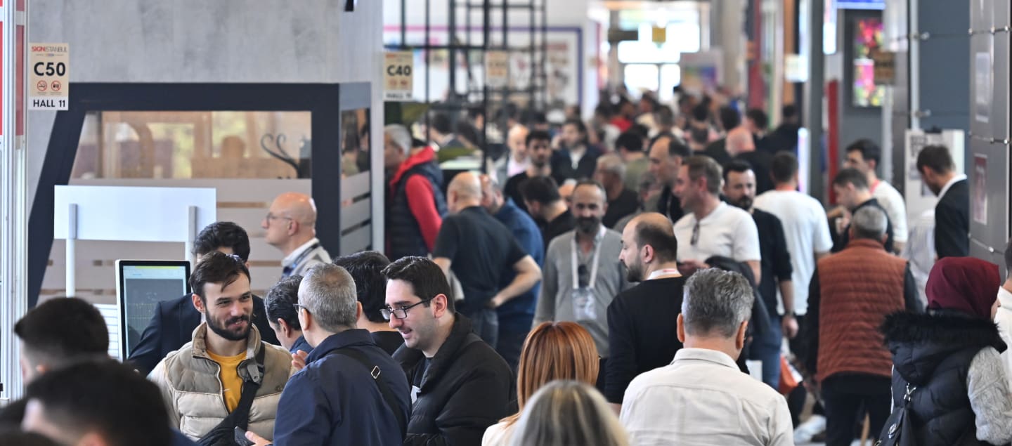 Crowd walking through an exhibition hall at SIGN İstanbul