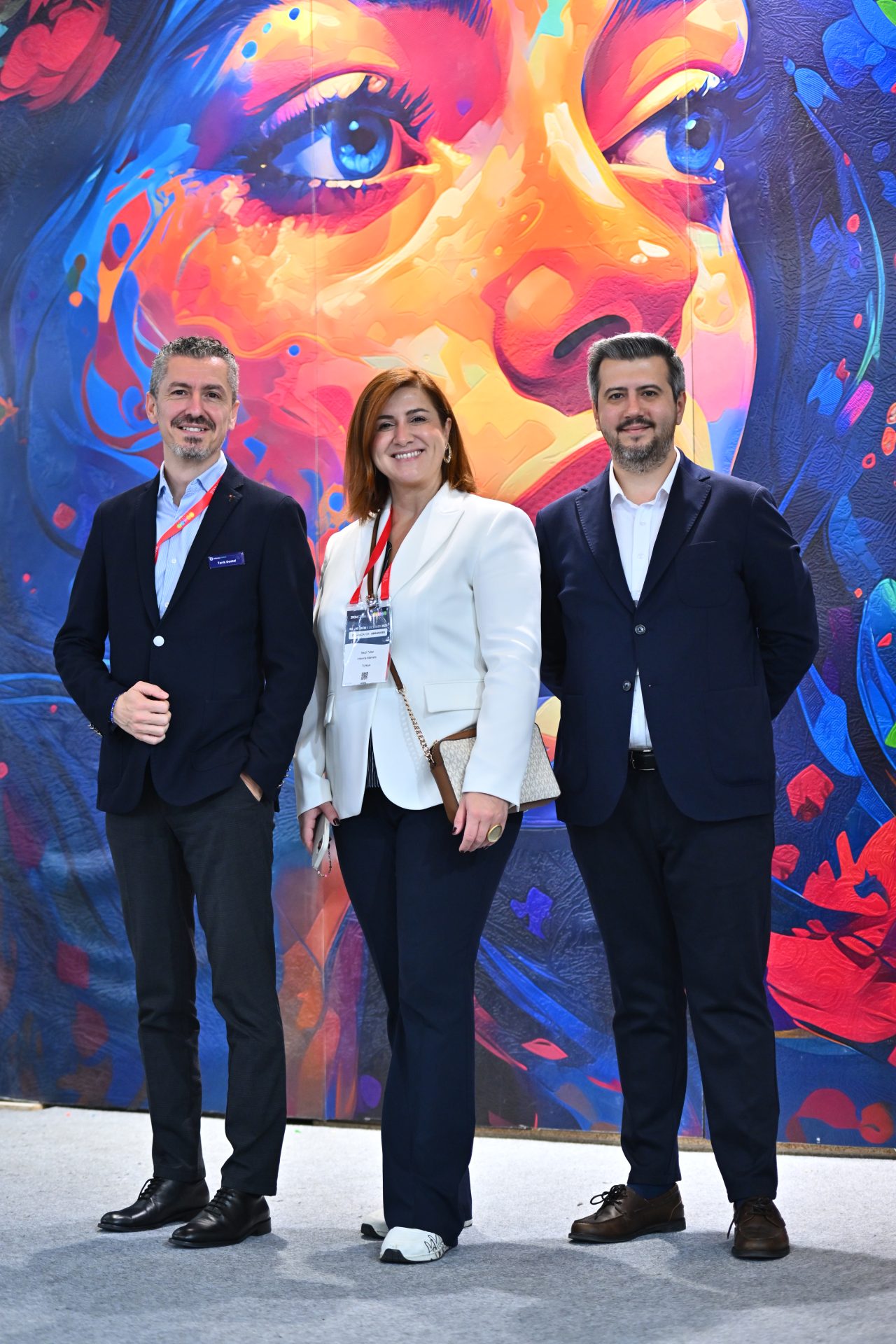 Networking and conversations taking place at the SIGN İstanbul event, with attendees in business attire