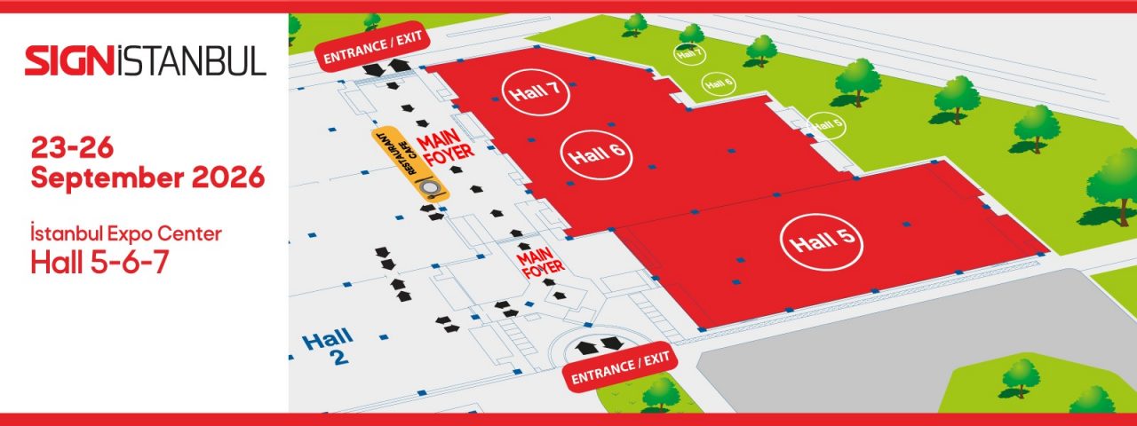 Visitors lining up for registration at SIGN İstanbul, with colorful banners and signs in the venue